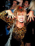 Designer Betsey Johnson Baring Teeth in Cat Pose at Party for Helmut Newton, Barneys Clothing Store