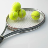 A Tennis Racket and Balls