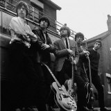 The Roling Stones: Group Pictured Holding Guitars